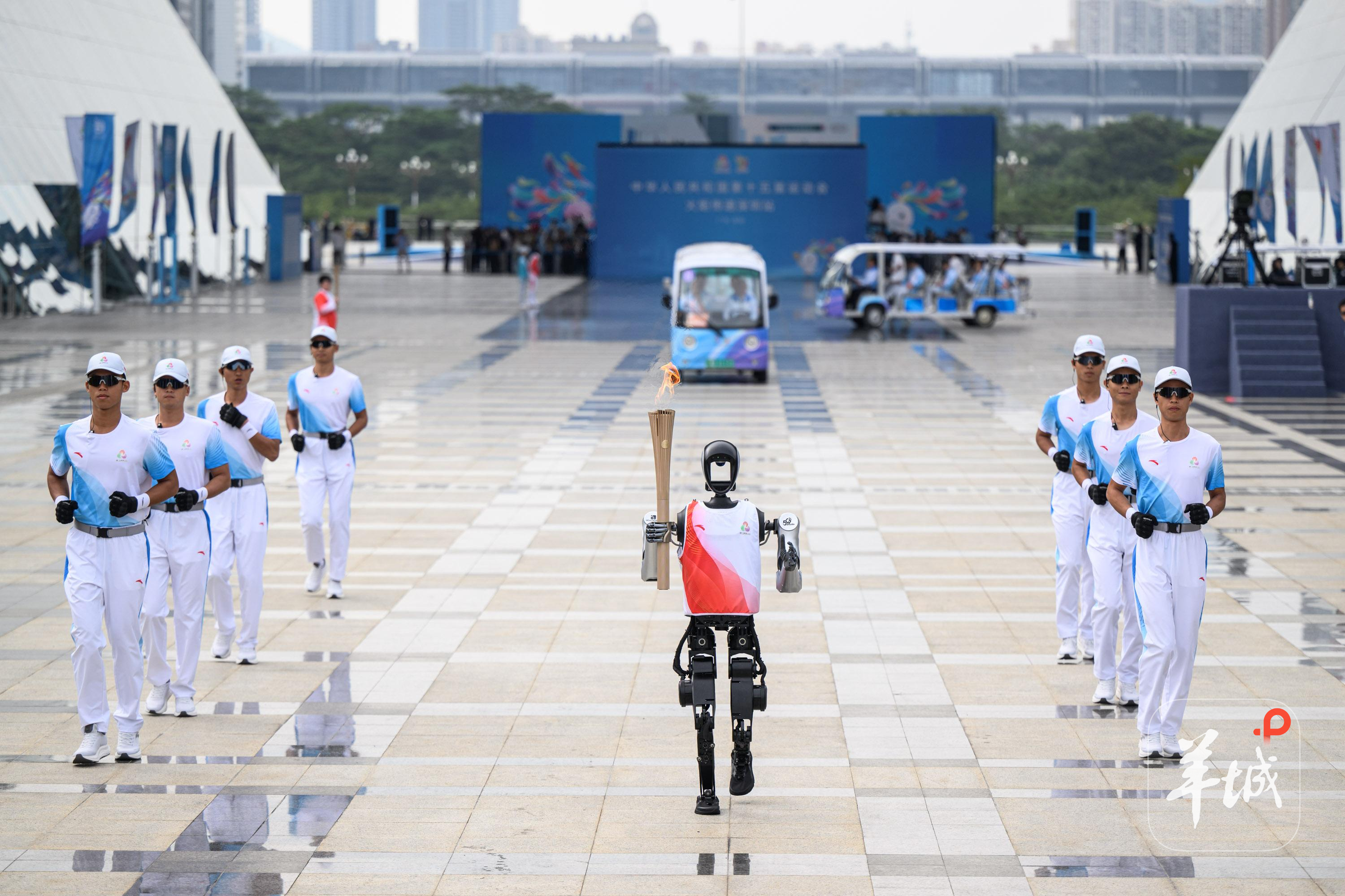 Robot passing torch and Guangdong women