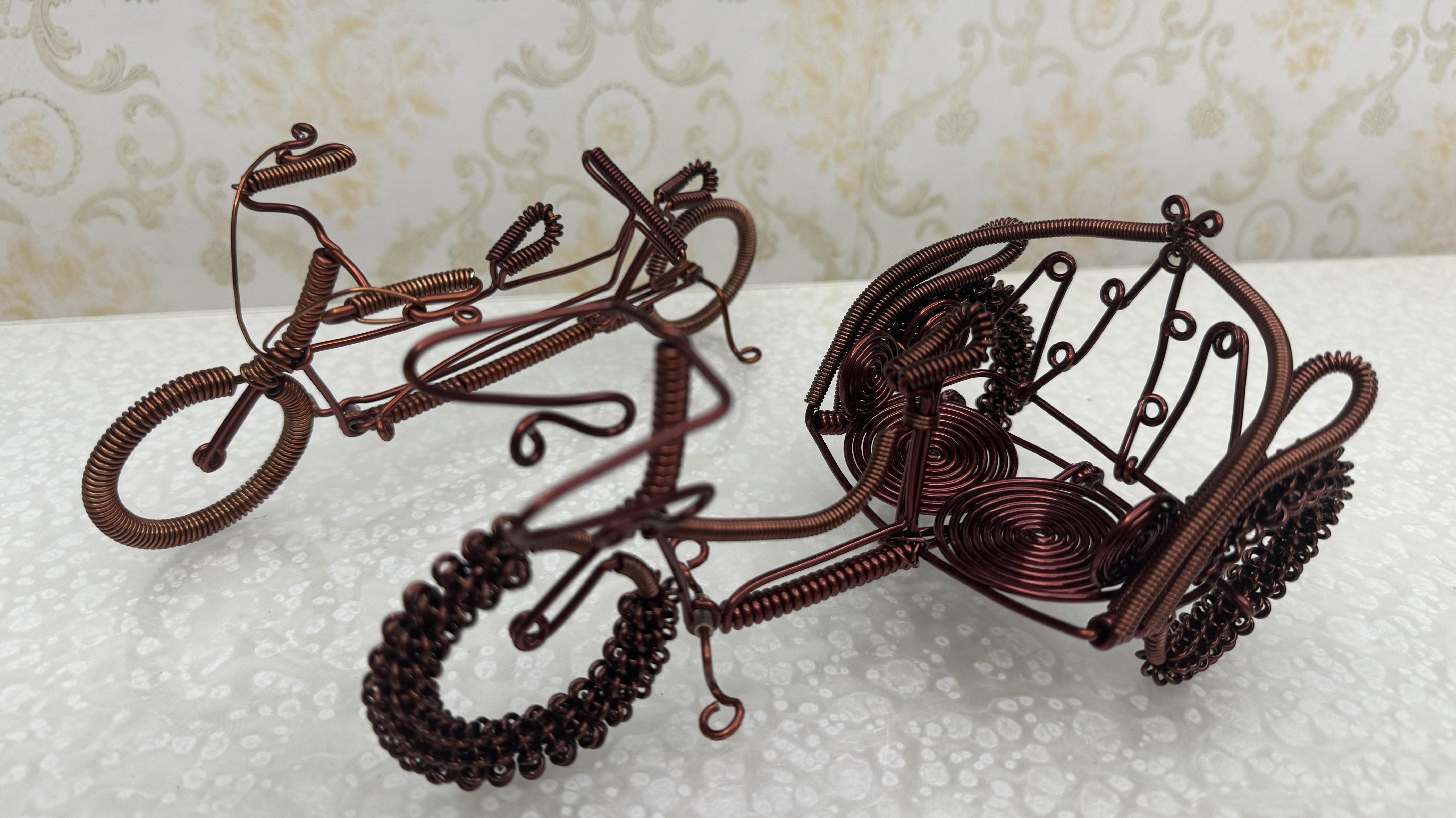 Copper-weaving craftsman creates miniature bicycle in just half hour!